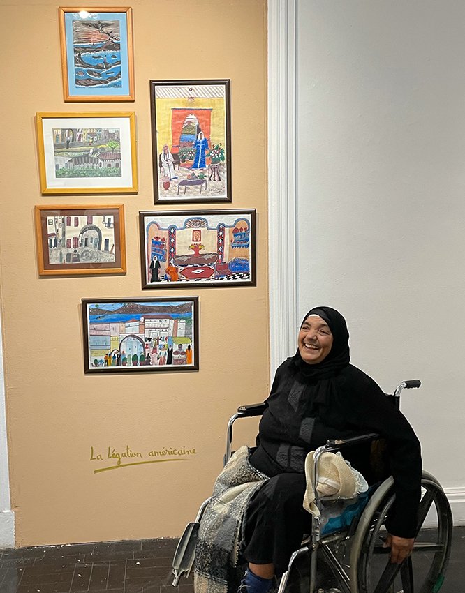Artist Fatima Gharbaoui with work